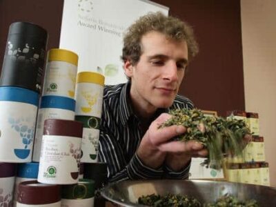 Master tea blender and medical herbalist Jorg Muller with one of his hand blended organic herbal teas.